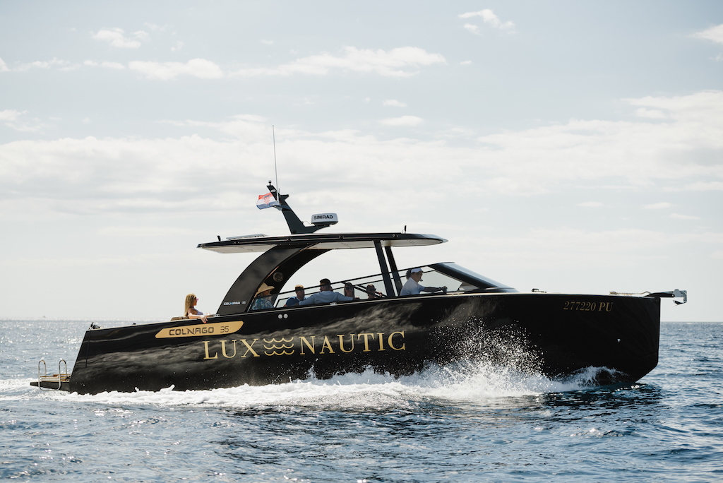 Skipper and hostess on The Black Pearl, Colnago 35 yacht from Lux Nautic