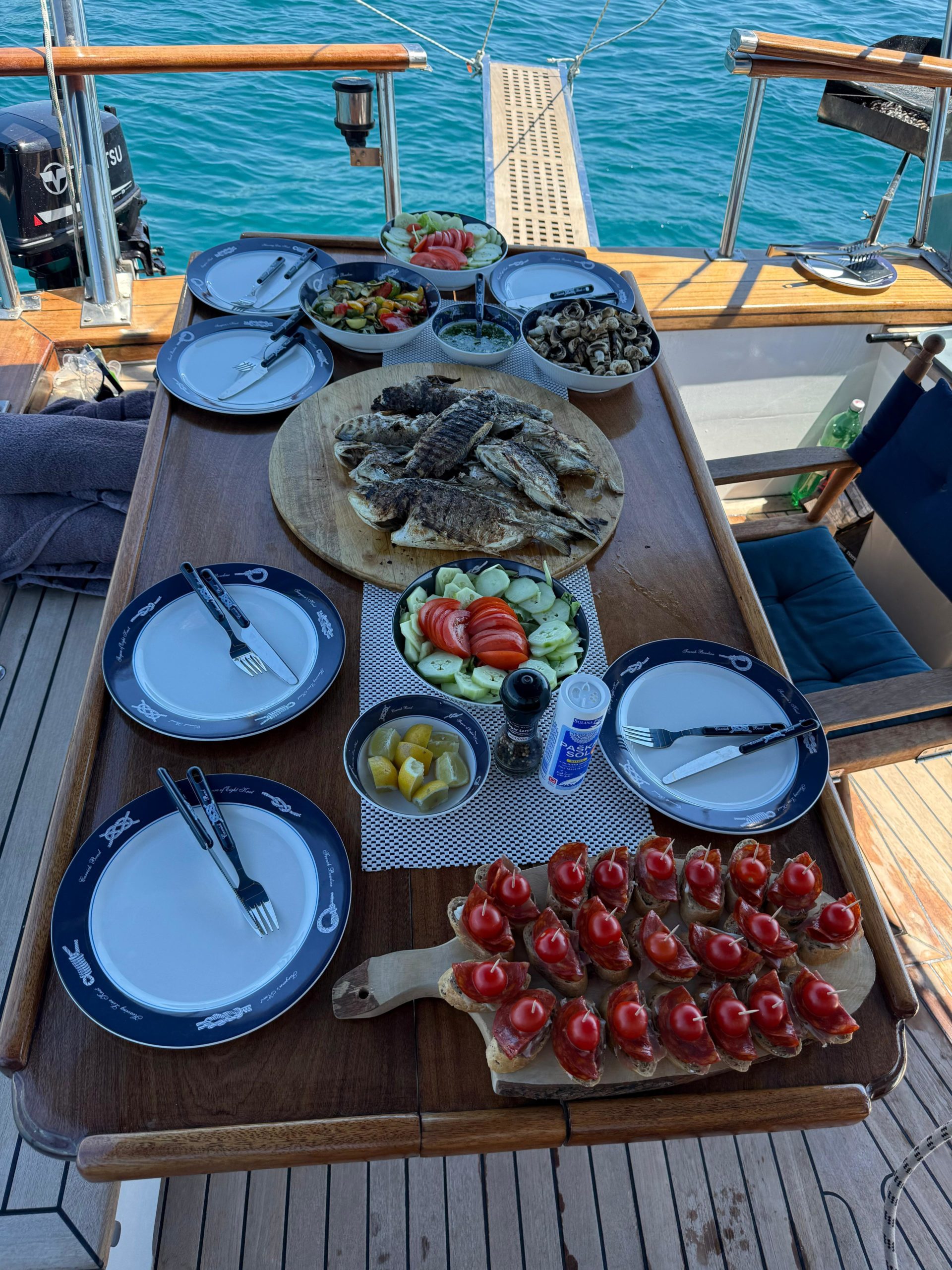 Lunch spread aboard Calypsa: grilled fish, salads and bruschetta